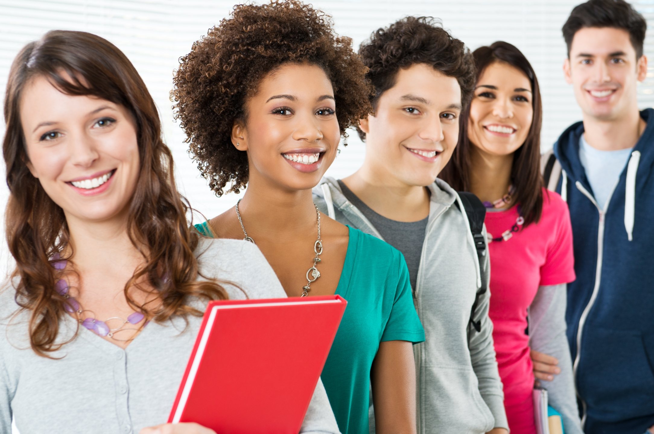 Happy Smiling Students Standing In Row