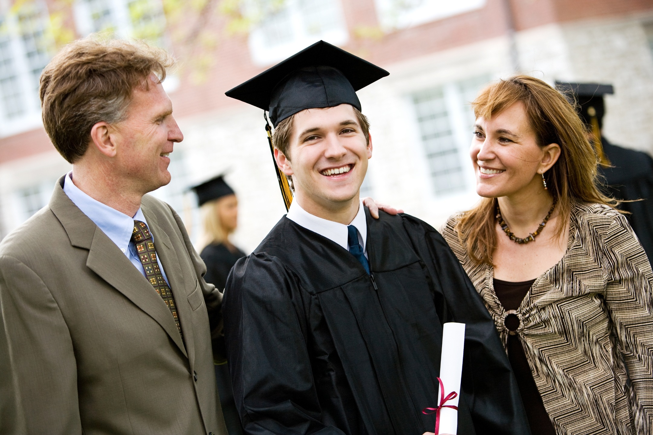 Graduation:,Proud,Male,Student,With,Parents